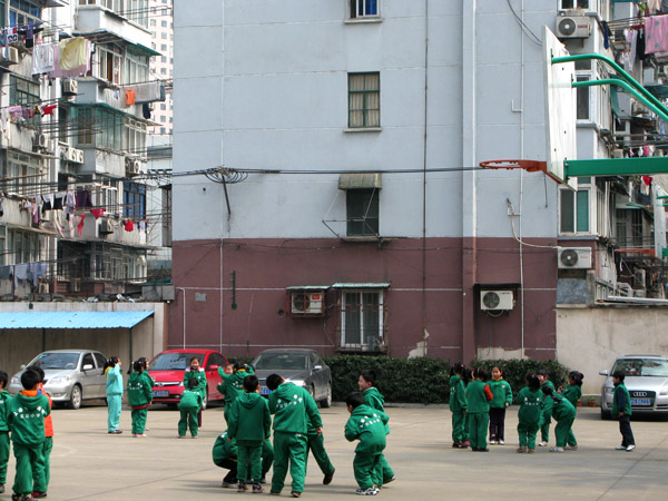 Kids playing with laundry behind