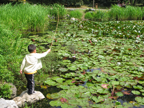 Boy fishing for Crawdads