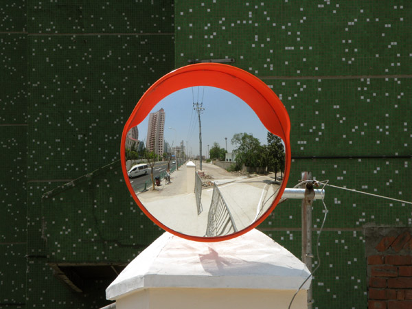 One of many mirrors to help construction traffic move safely.