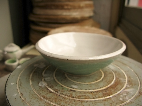 The bowl is about 4" in diameter and 1 1/2" tall