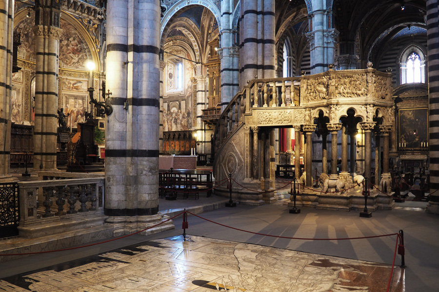 The pulpit and carved stone floors of the Siena Cathedral