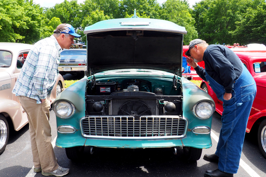 Uncle Don and Dad checking out a Chevy